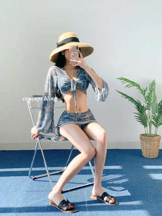 Vintage denim piece bikini with cardigan cover-up skirt and string body-covering tummy-covering swimsuit