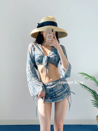 Vintage denim piece bikini with cardigan cover-up skirt and string body-covering tummy-covering swimsuit