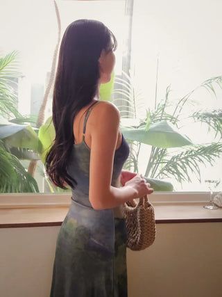 Resort long one-piece dress with a body-shaping slip straps a loose fit and a lining for a travel look or a vacation look. A silky fit and tie-dye one-piece dress for summer.