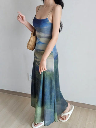 Resort long one-piece dress with a body-shaping slip straps a loose fit and a lining for a travel look or a vacation look. A silky fit and tie-dye one-piece dress for summer.