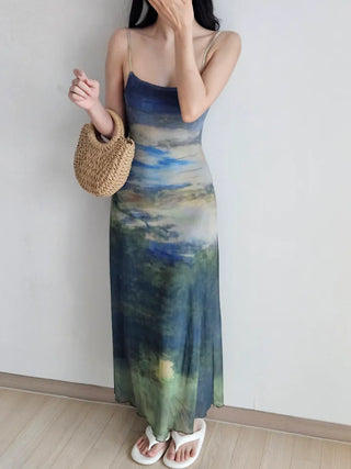 Resort long one-piece dress with a body-shaping slip straps a loose fit and a lining for a travel look or a vacation look. A silky fit and tie-dye one-piece dress for summer.