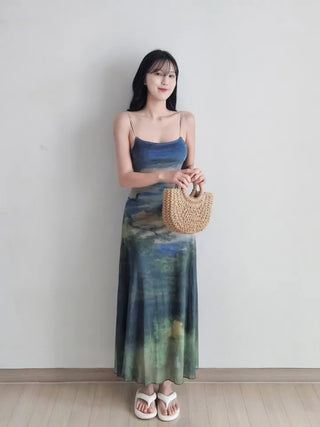 Resort long one-piece dress with a body-shaping slip straps a loose fit and a lining for a travel look or a vacation look. A silky fit and tie-dye one-piece dress for summer.