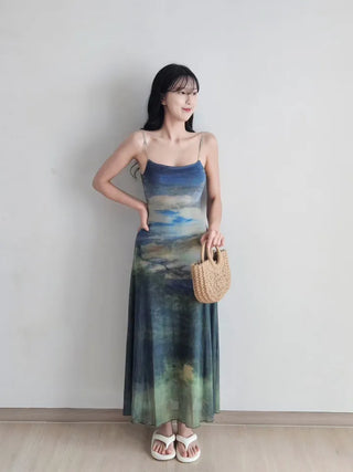 Resort long one-piece dress with a body-shaping slip straps a loose fit and a lining for a travel look or a vacation look. A silky fit and tie-dye one-piece dress for summer.