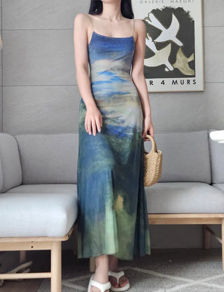 Resort long one-piece dress with a body-shaping slip straps a loose fit and a lining for a travel look or a vacation look. A silky fit and tie-dye one-piece dress for summer.