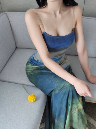 Resort long one-piece dress with a body-shaping slip straps a loose fit and a lining for a travel look or a vacation look. A silky fit and tie-dye one-piece dress for summer.