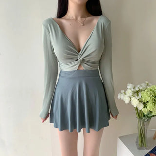twist pastel long sleeve ballet core one-piece swimsuit