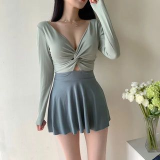 twist pastel long sleeve ballet core one-piece swimsuit