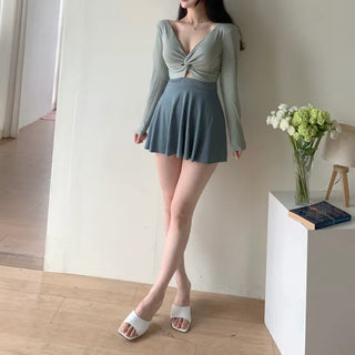 twist pastel long sleeve ballet core one-piece swimsuit
