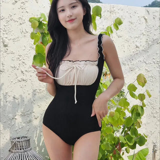 Ivory shirring ribbon frill ruffle color block black ribbed one-piece swimsuit
