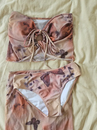 Butterfly bikini see-through piece swimsuit set with long skirt and cover-up for a delicate beach look and halter neck swimsuit.