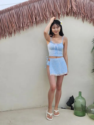 A pure sky blue floral piece set with a crop top belly-covering wrap skirt and a beach look/vacation look cover-up swimsuit.
