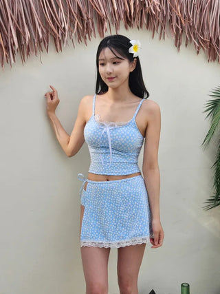 A pure sky blue floral piece set with a crop top belly-covering wrap skirt and a beach look/vacation look cover-up swimsuit.