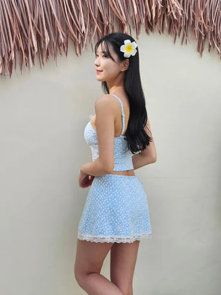 A pure sky blue floral piece set with a crop top belly-covering wrap skirt and a beach look/vacation look cover-up swimsuit.