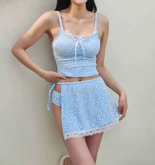 A pure sky blue floral piece set with a crop top belly-covering wrap skirt and a beach look/vacation look cover-up swimsuit.
