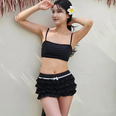 Black frill piece bikini set with crop top cover-up skirt and ribbon strap swimsuit