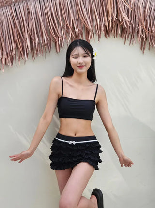 Black frill piece bikini set with crop top cover-up skirt and ribbon strap swimsuit