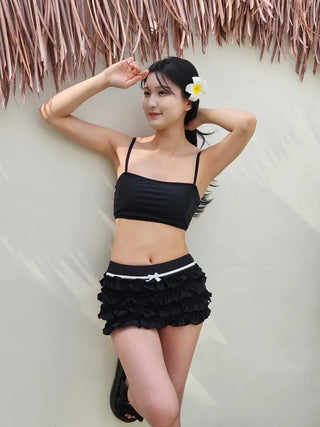 Black frill piece bikini set with crop top cover-up skirt and ribbon strap swimsuit