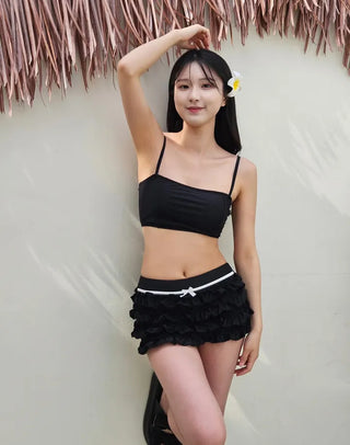 Black frill piece bikini set with crop top cover-up skirt and ribbon strap swimsuit