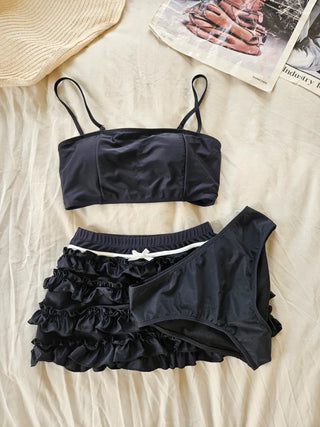 Black frill piece bikini set with crop top cover-up skirt and ribbon strap swimsuit