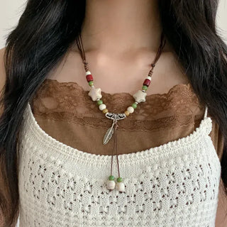 Feather n'Pipe Ceramic Knot Long Necklace