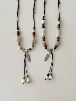 Feather n'Pipe Ceramic Knot Long Necklace