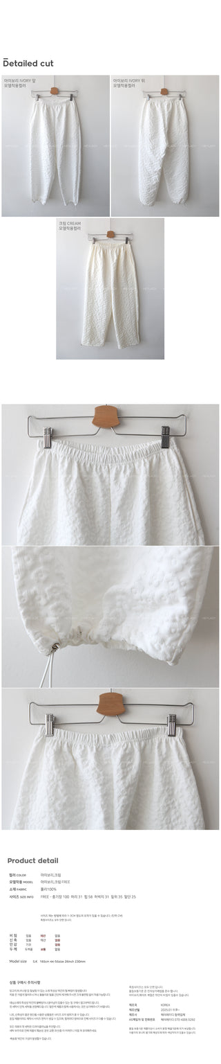 Flower embossed elastic waist pants