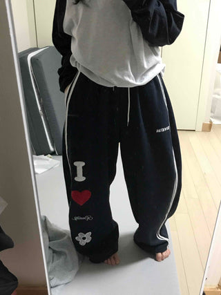 Kitsch Embossed Track Long Pants