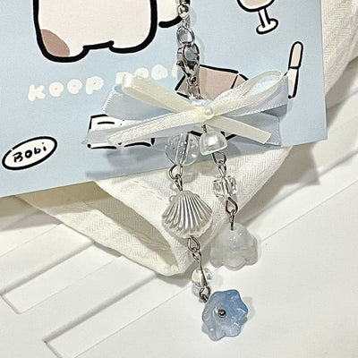 Bow sea shell charm