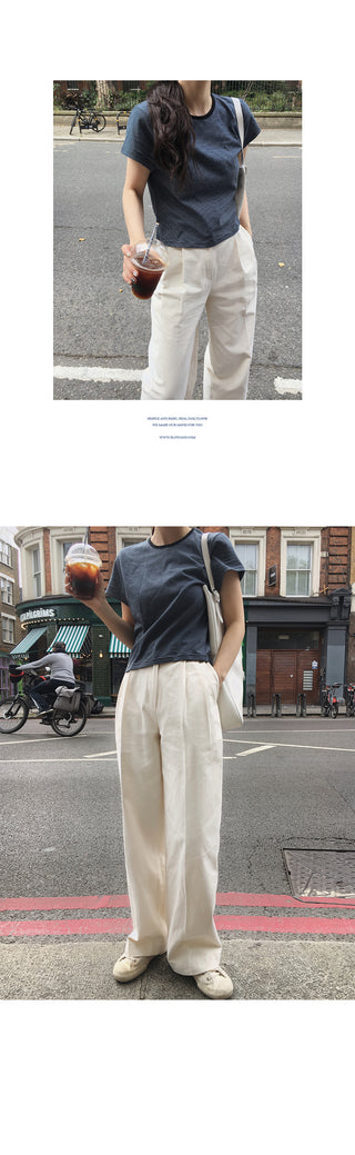 Wide cotton slacks with pleats