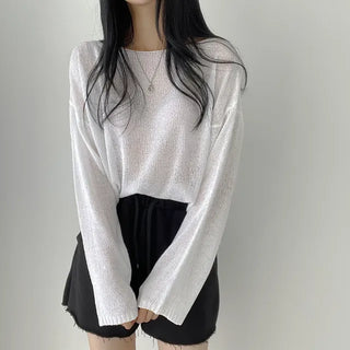 Delicate, flowing loose fit, boat neck sheer boucle long-sleeve knit