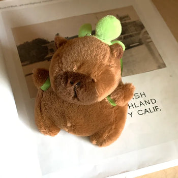 Turtle backpack, capybara keyring, plush toy, AirPods case