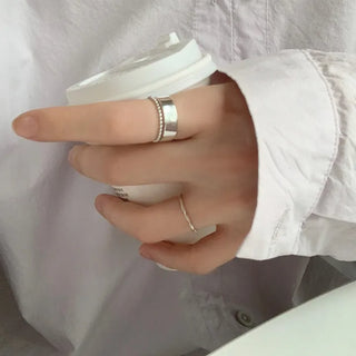 layered bead ball flat open, giving the look of wearing two rings.