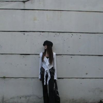 Black bootcut pants with cut hems