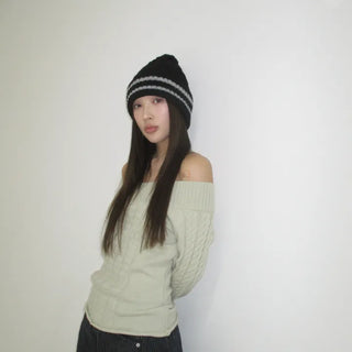 Cable knit off-shoulder knit