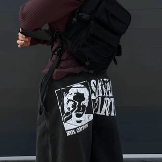 Cross pendant graphic pants