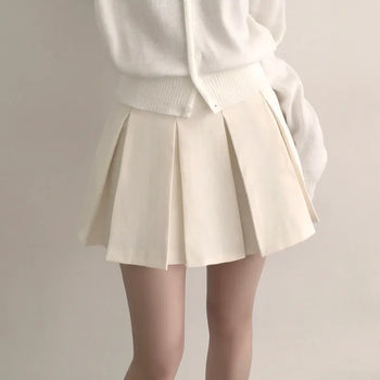 Timeless high-waisted pintuck pleated mini skirt to wear every year