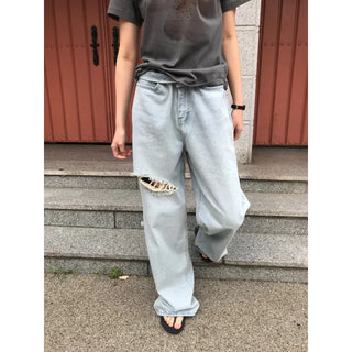 Damaged denim pants