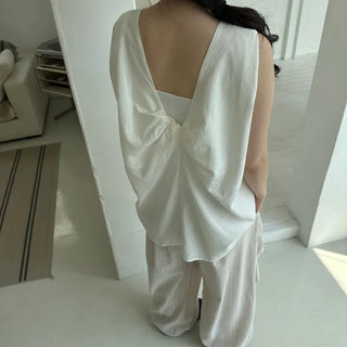 Twisted-back sleeveless blouse