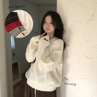 Flowing, protective fit, Thick wool V-neck avant-garde loose fit long-sleeve knit with sleeve label