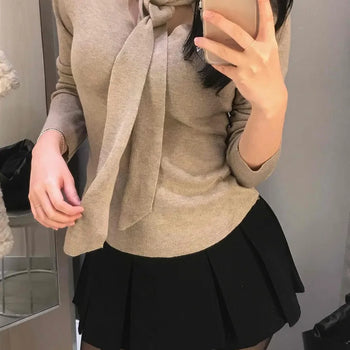 Slim Knit with Strap Ribbon Neck Detail for Year-End Looks