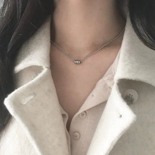 Surgical double-strand necklace