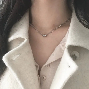 Surgical double-strand necklace
