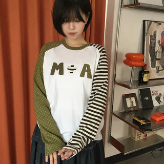 Asymmetrical embroidered raglan t-shirt