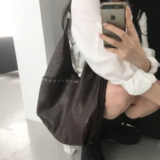 Eyelet shoulder bag