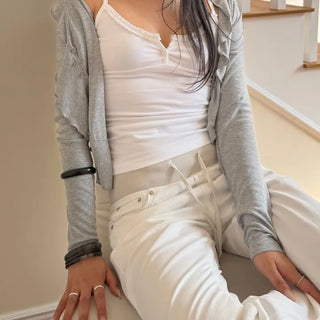 FRILL TWO-BUTTON SLEEVELESS