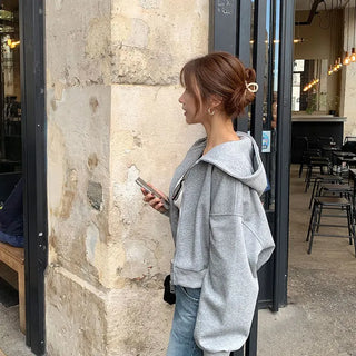 Voluminous hooded zip-up jumper