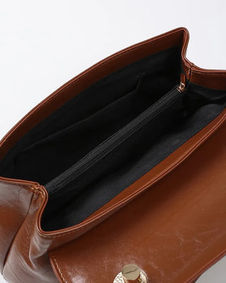 One-button leather handbag