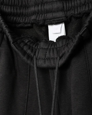 Wide sweatpants with side pockets