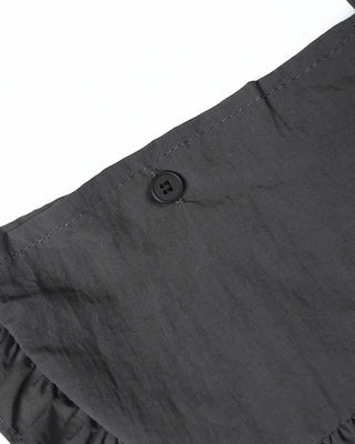 Mid-length pleated skirt with bag