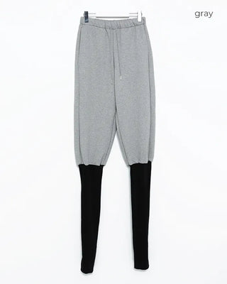 Open-heel ribbed knee-high socks layered pants